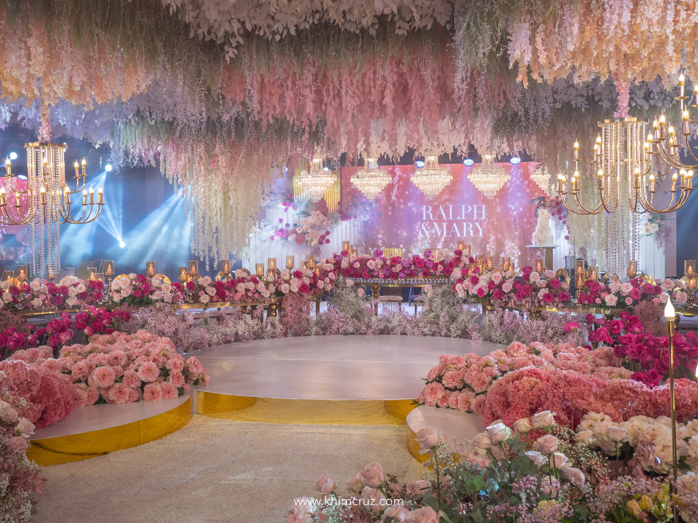 dreamy pink hues floral arrangement enclosing the dance at the wedding reception of Ralph & Mary designed by Khim Cruz