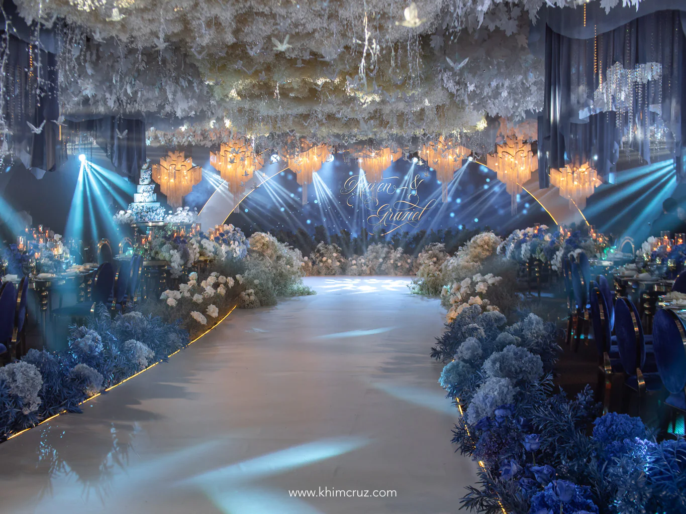 gradient blue floral arrangement on the dance floor for a cloud-filled setting with hanging chandeliers for a dreamy blue ethereal wedding