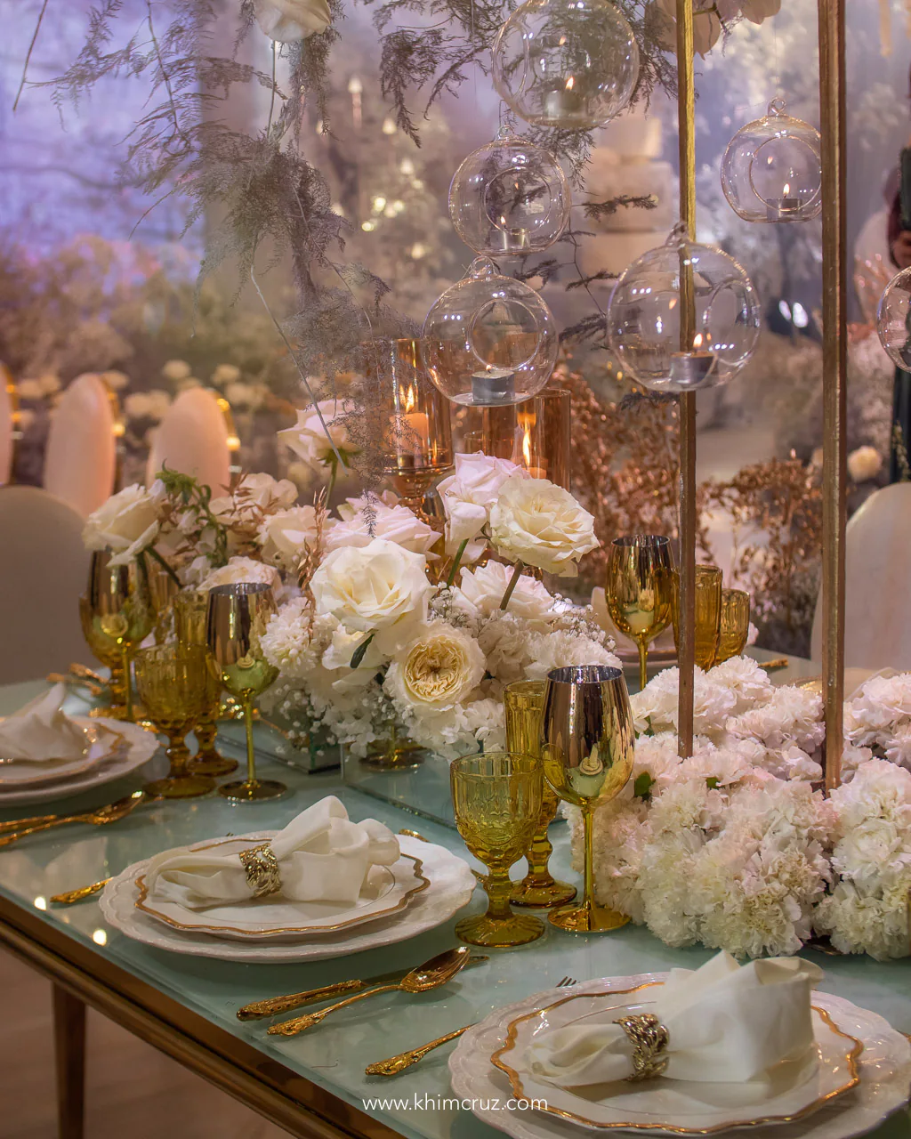 table floral centerpieces setting with cutleries for the 50th golden wedding anniversary reception