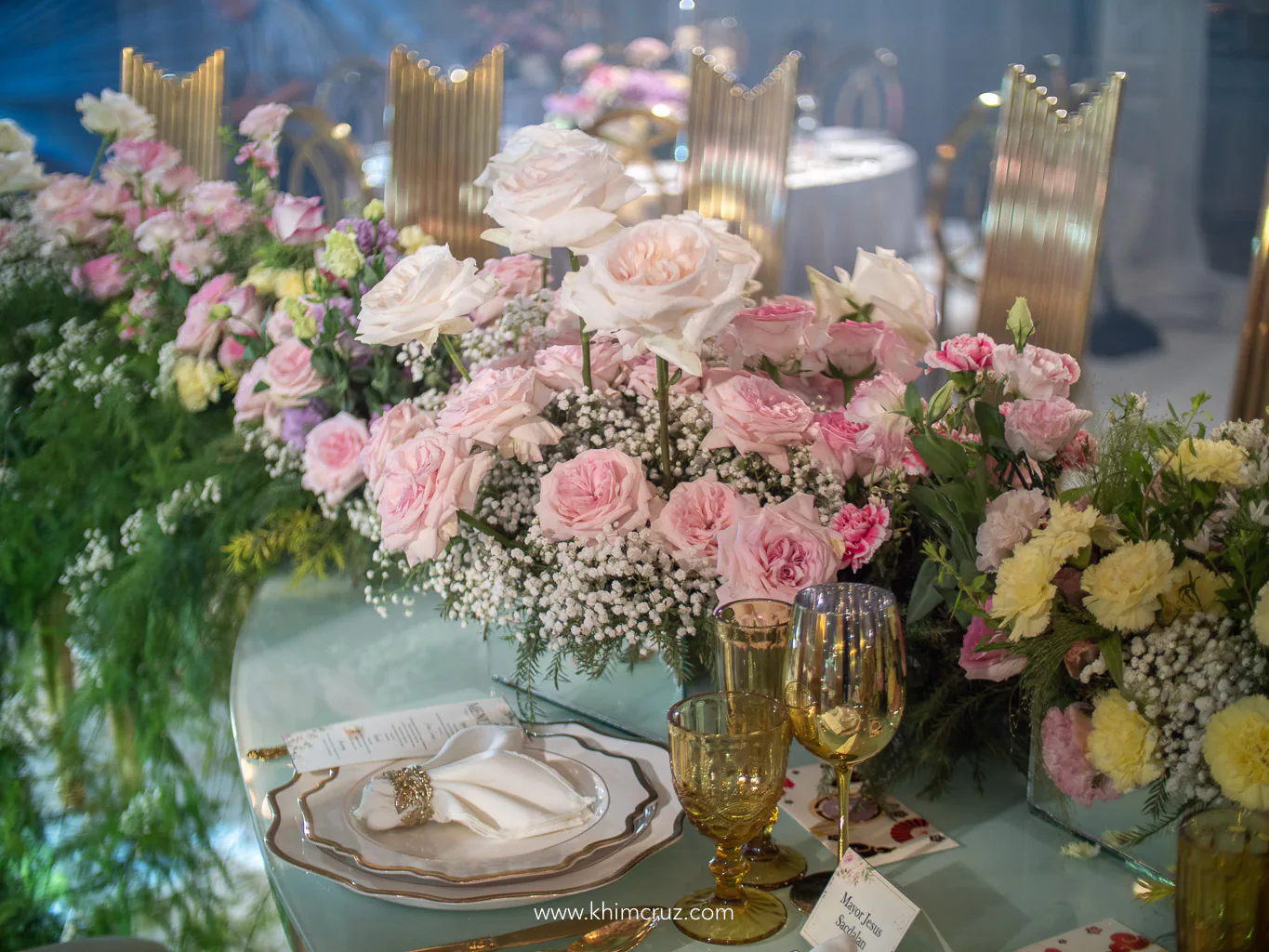 wedding table centerpieces with soft pastel flowers arranged by Khim Cruz