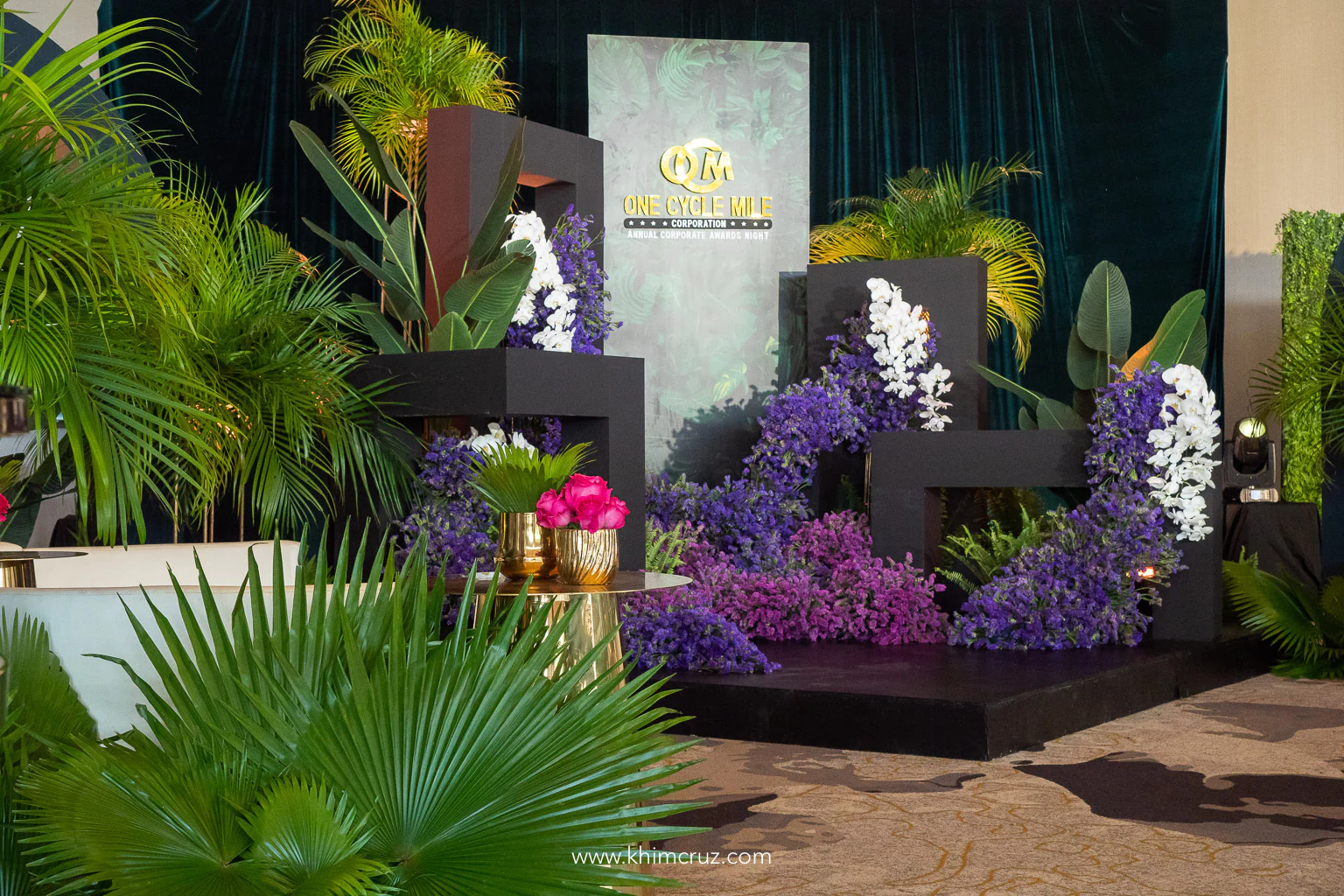 modern tropical themed corporate awards gala photo zone at cocktail area