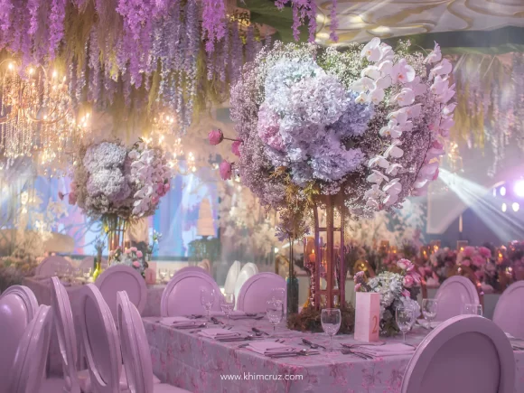 18th birthday debut inspired by chateau gardens tall floral table centerpieces designed by florist Khim Cruz