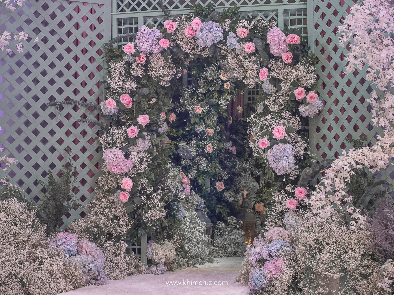 entrance tunnel to a chateau gardens themed debut 18th birthday celebration