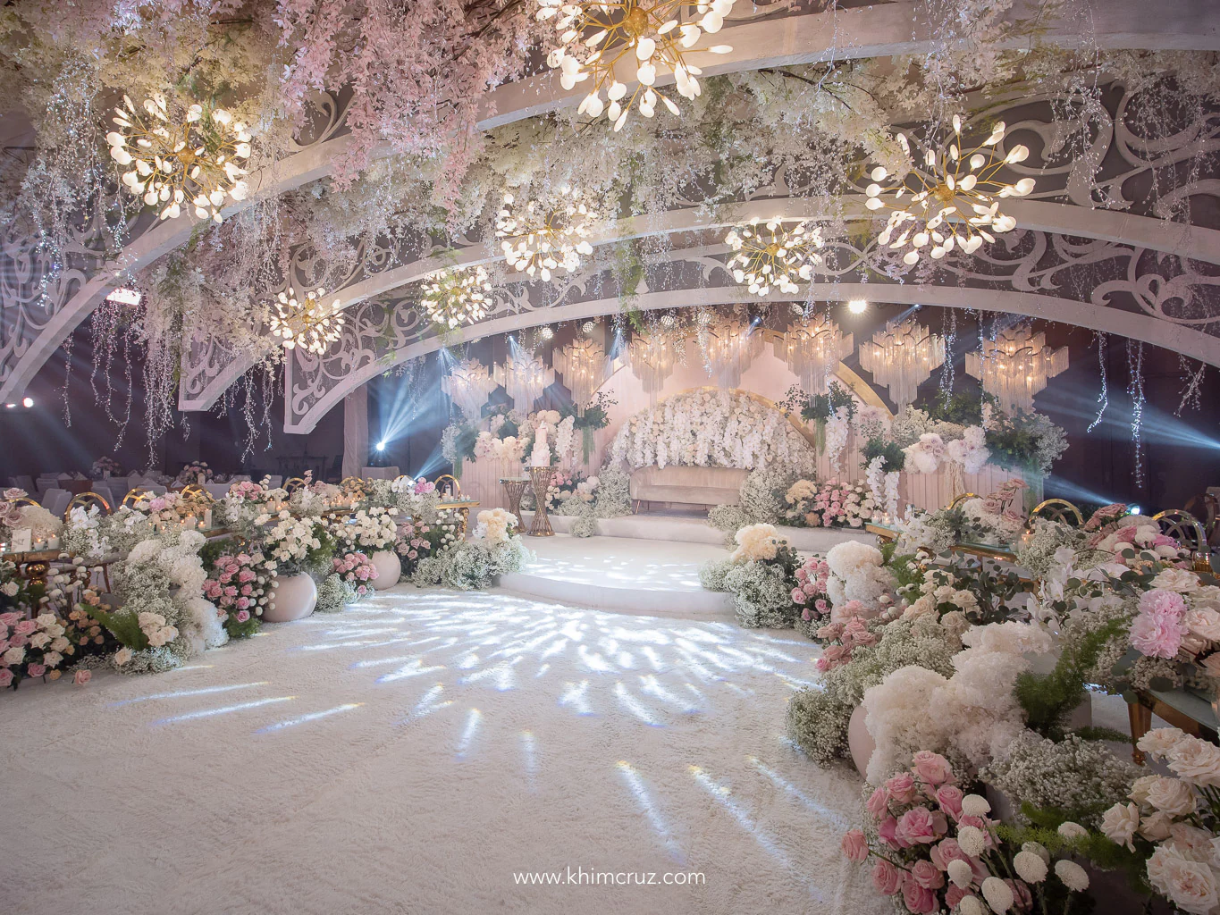 garden-inspired intimate wedding with ceiling arches and chandeliers designed by Khim Cruz