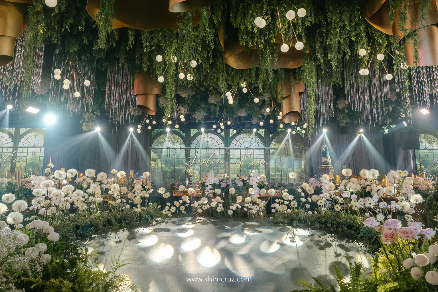 floral design enclosing the dance floor of a dreamy conservatory-inspired wedding reception