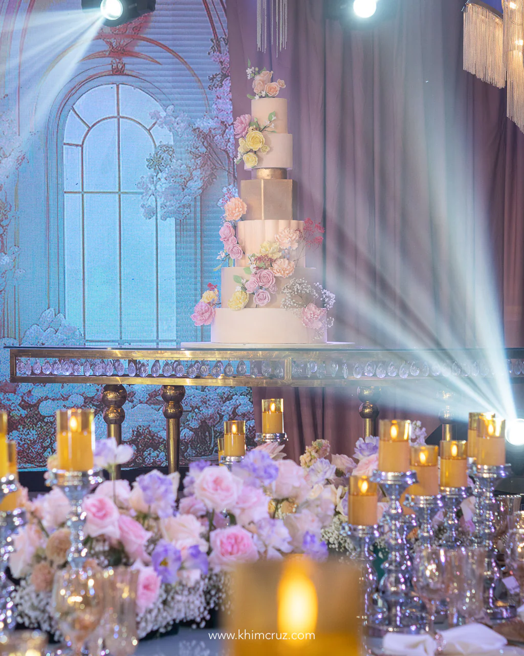 beautiful cake at a dreamy floral garden wedding reception