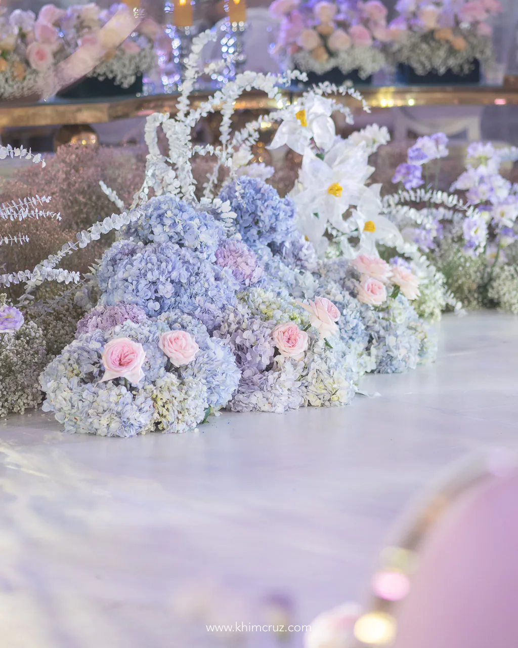 beautiful flowers at the aisle for a dreamy garden theme wedding reception