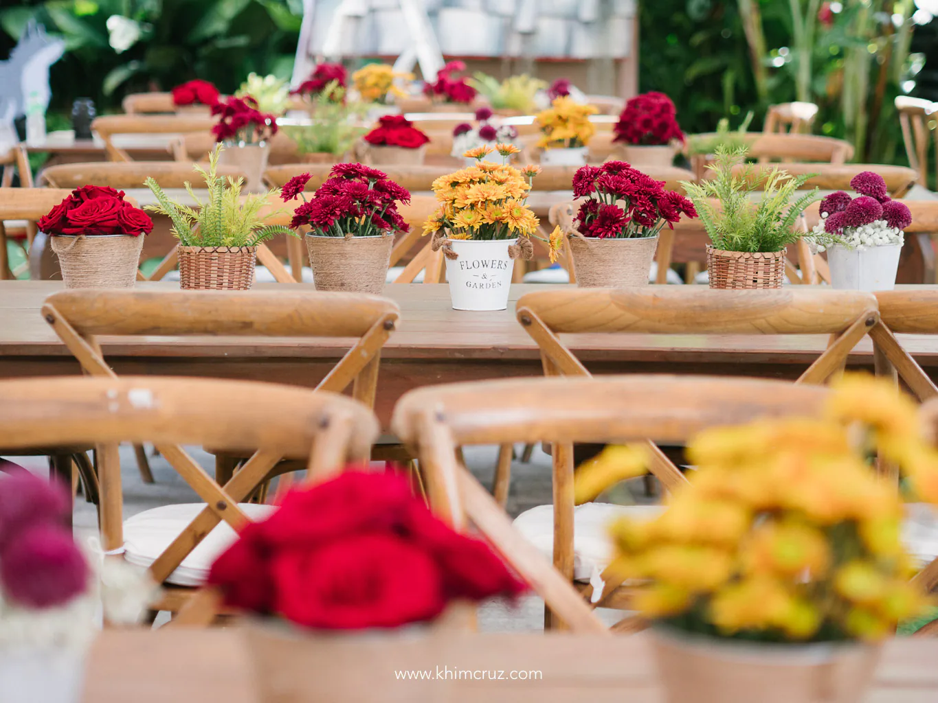 into the woods halloween event colorful table floral centerpieces on benches