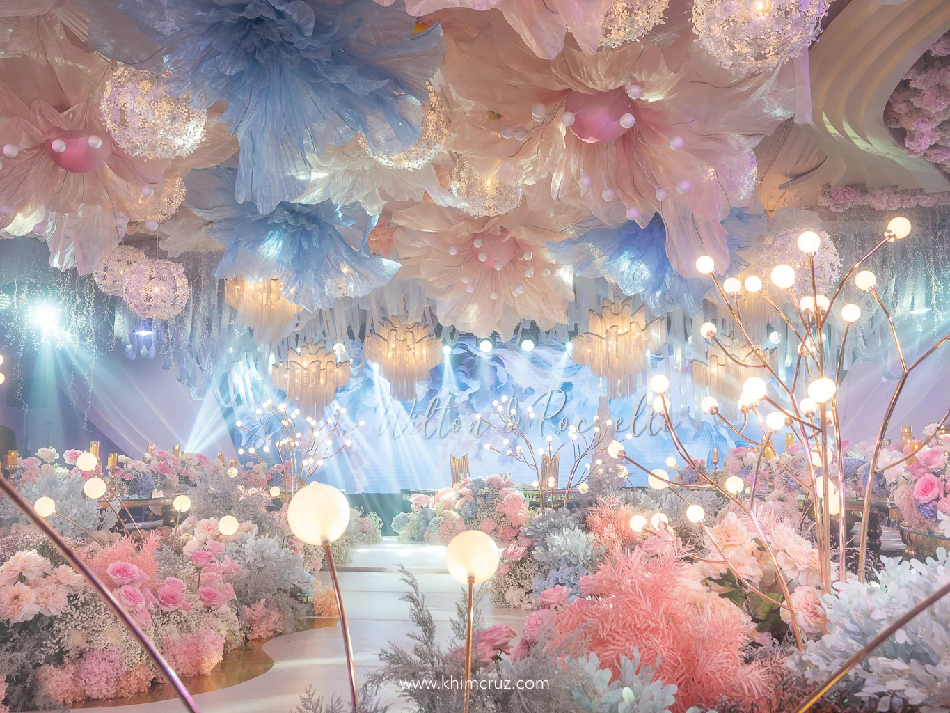 dreamy floral escape wedding hanging oversized floral designs and chandeliers
