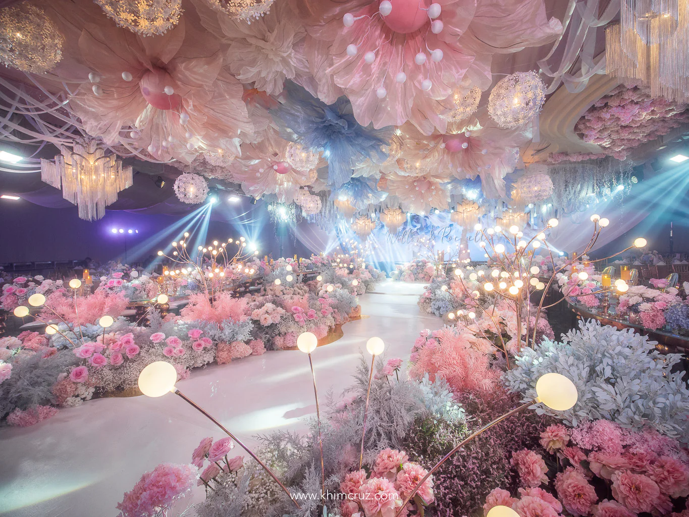 dreamy floral escape wedding with oversized hanging floral designs and floral landscape walkway by Khim Cruz