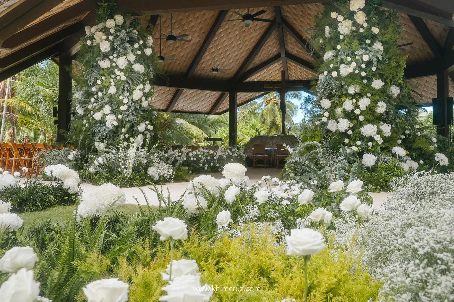 a pair of pillar florals stand as entrance of the wedding ceremony of Matthew and Monica's destination wedding design by Khim Cruz