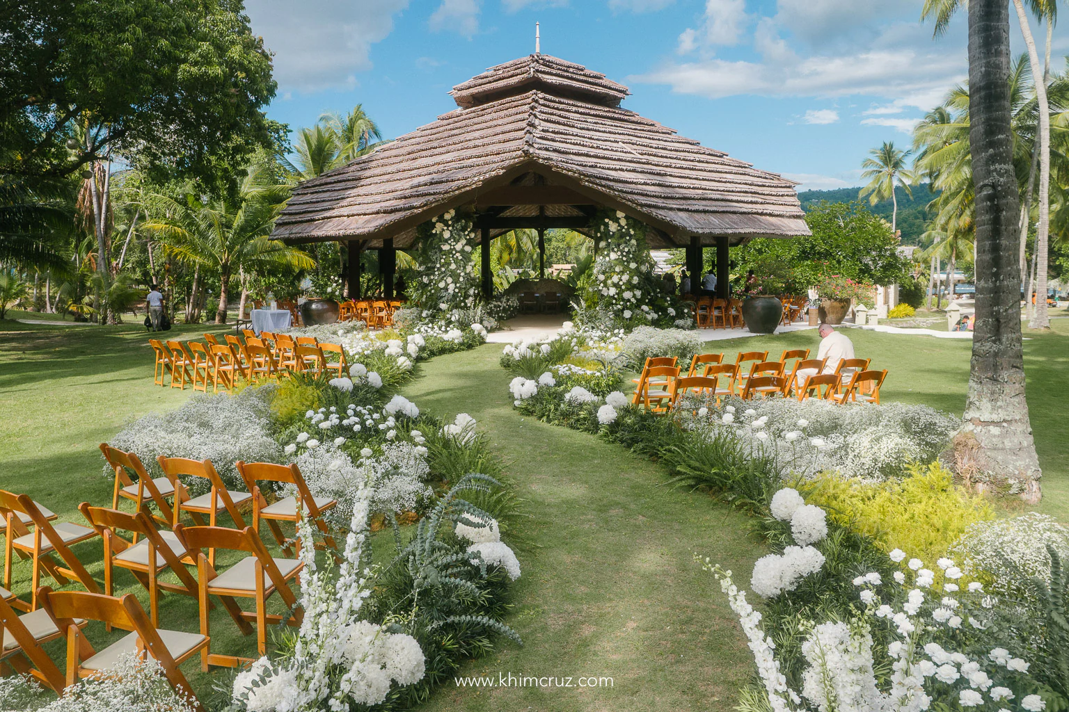 outdoor field of flowers for a wedding ceremony Malipano island destination wedding by Khim Cruz