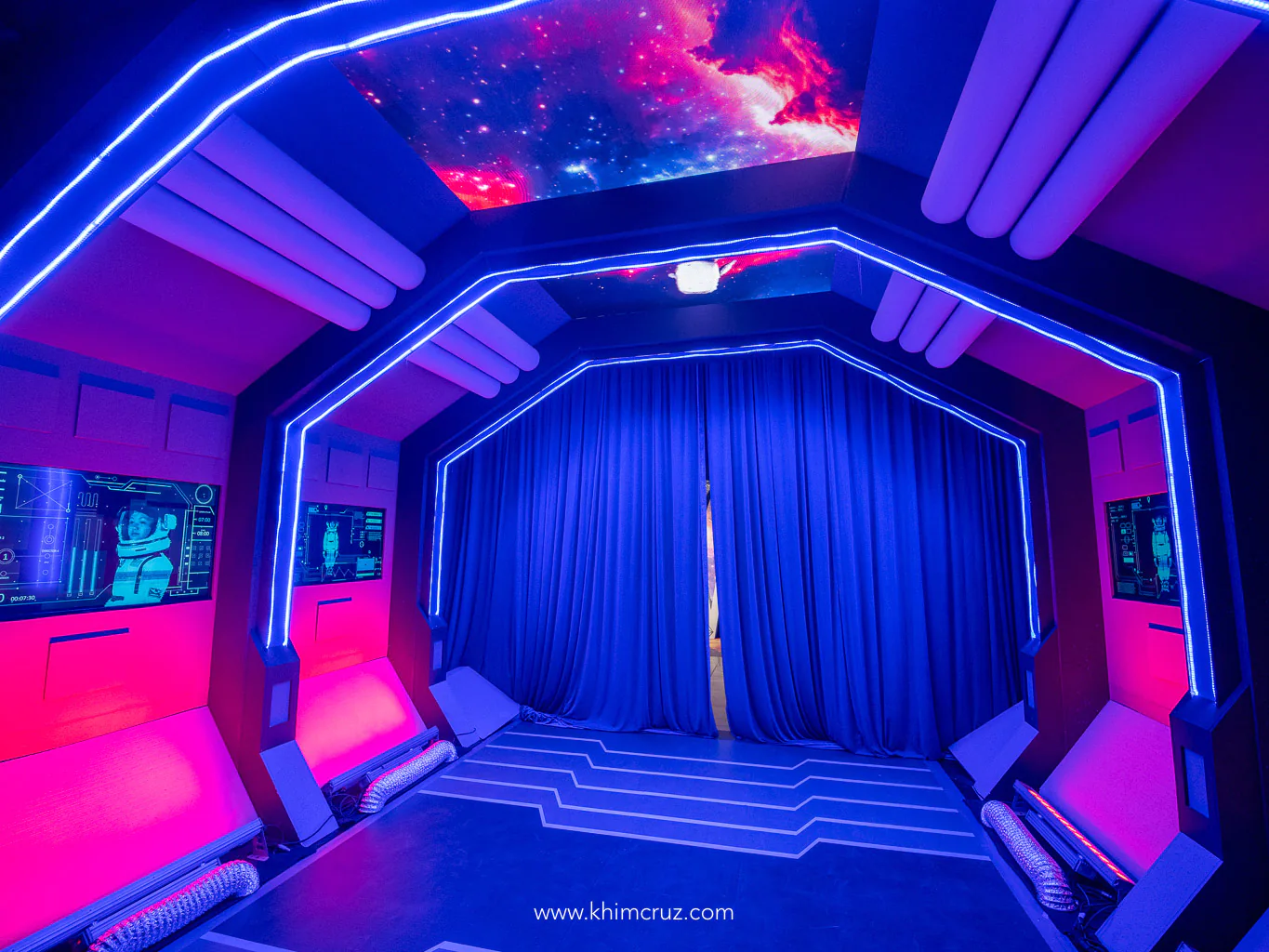 spacecraft tunnel featuring wall visual overlay screens and dynamic ceiling showcasing outer space vistas
