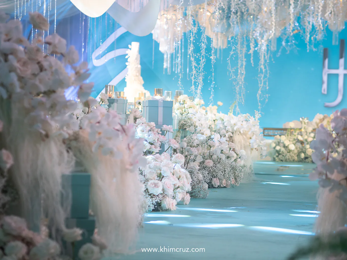 a thematic design with white florals for the bridal walkway