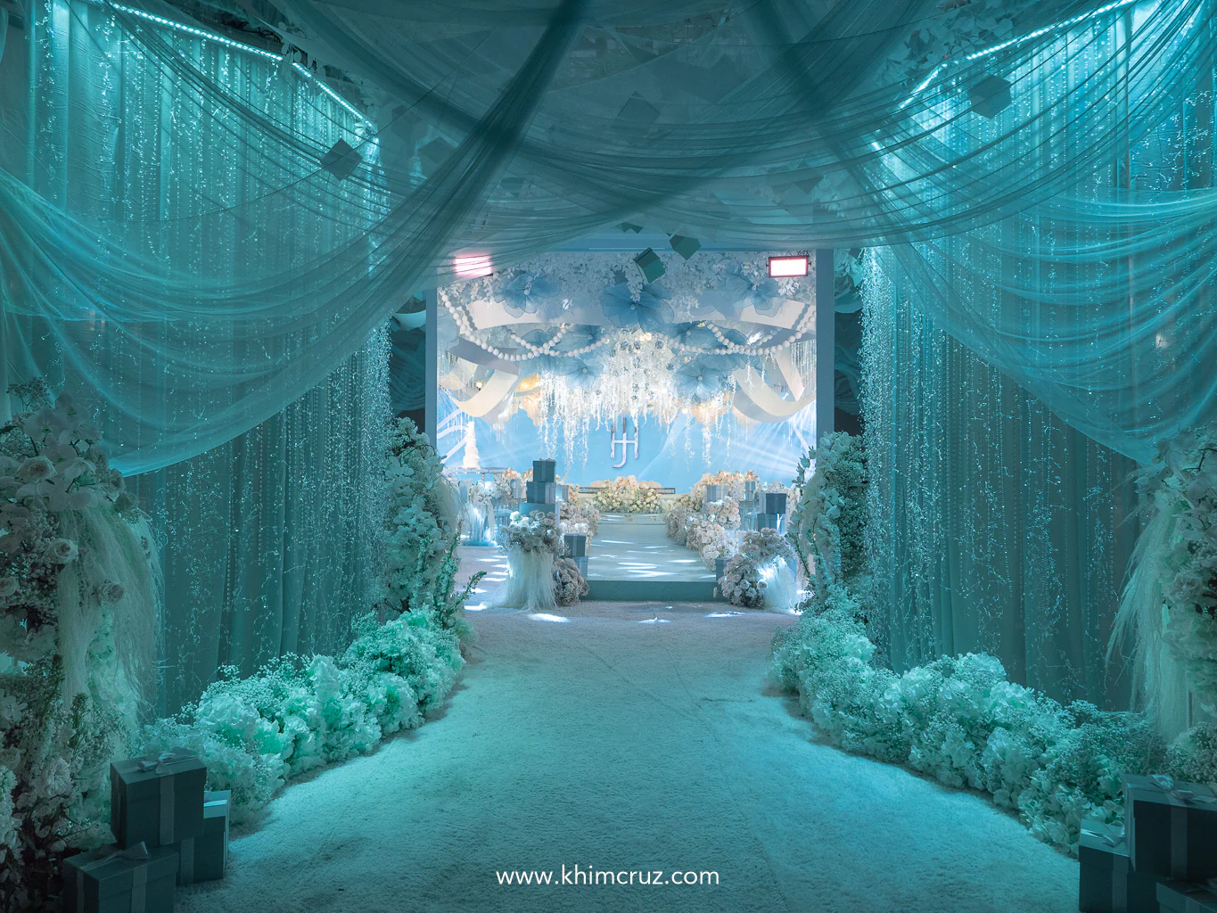 cascading crystals on walls mimic falling diamonds at the entrance for a Tiffany-inspired wedding reception
