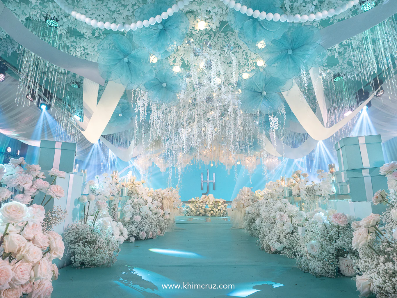 white floral arrangements pearls turquoise boxes and signature white ribbon can be seen on this Tiffany-inspired wedding