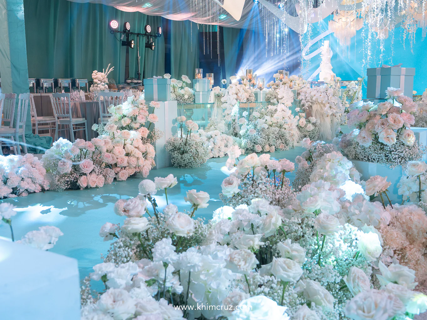 white florals and turquoise boxes on the walkway