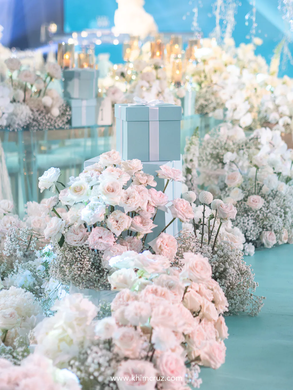 white florals graced the walkway dance floor and tables for sophisticated feel at the reception