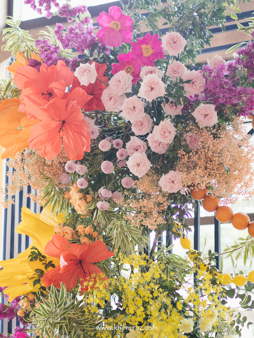 A burst of colorful blooms framed the ceremony arch, bringing Lake Como’s vibrant romance to TJ & Ruth’s wedding ceremony