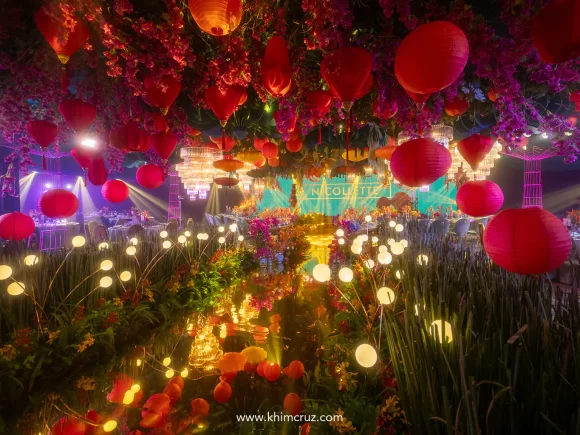 A mirrored water aisle made the debutant walk feel like a dream floating on light on Crazy Rich Asians themed debut