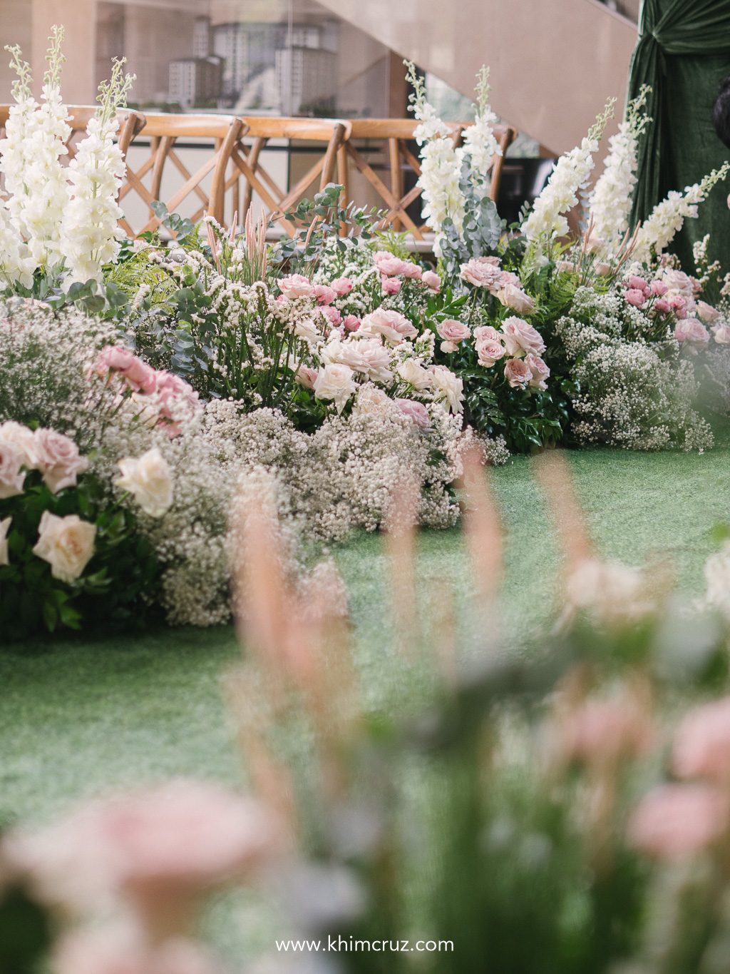 Art Nouveau wedding ceremony softened by lush greenery