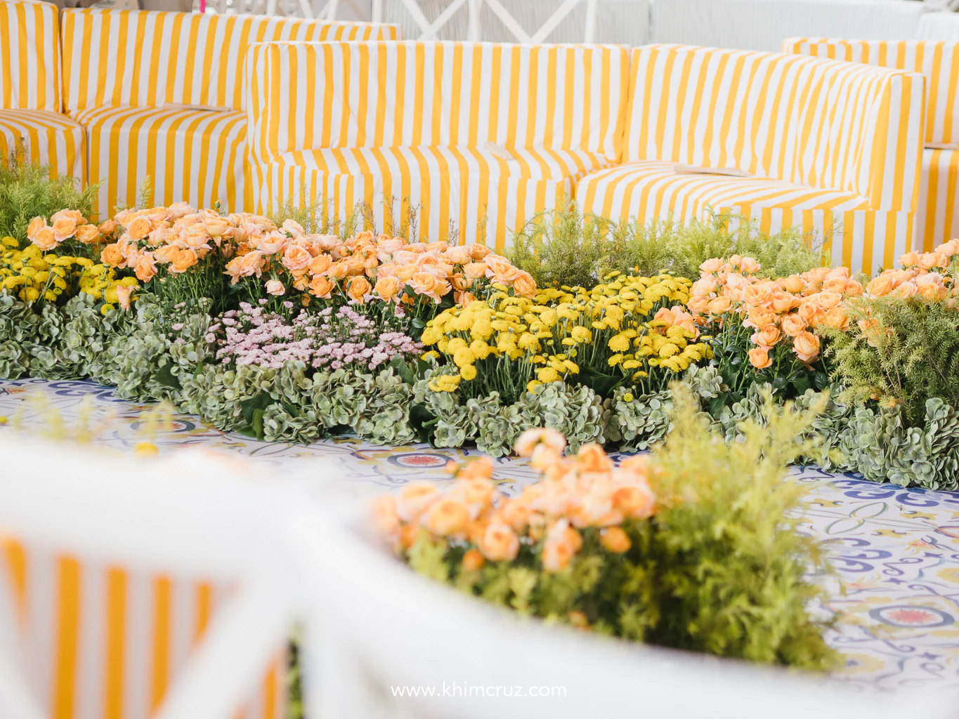 This #styledbyKhim wedding ceremony channeled the romance of Lake Como with majolica tiles striped seats and vibrant florals
