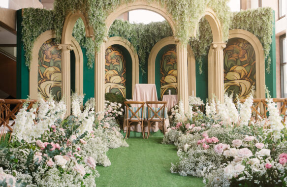 wedding ceremony backdrop mimicked a stained-glass with classic architectural arches