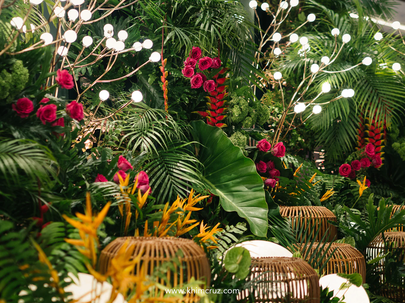 cascading greens and fresh floral detail on the modern tropical luxe photo backdrop