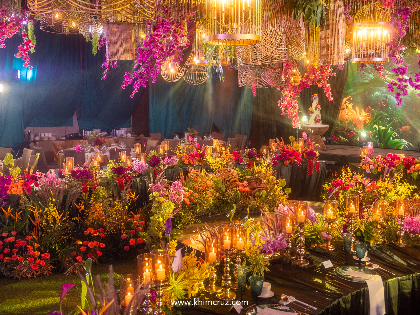 modern tropical luxe wedding reception that glows with golden light and lush sophistication
