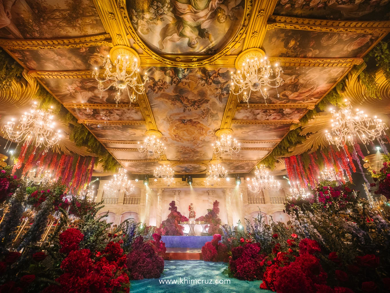 renaissance-debut-ballroom-painted-ceiling-chandeliers-red-floral-walkway-khim cruz