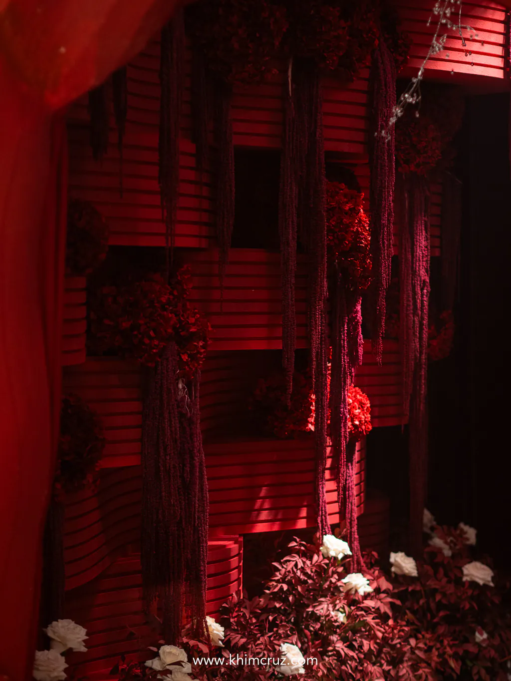 sculptural-red-floral-installation-cascading-strands-wedding-backdrop-khim-cruz