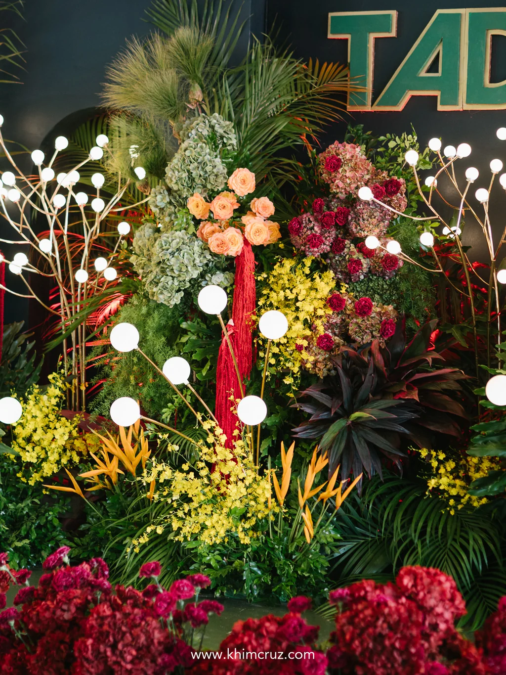 tadeco-75th-anniversary-tropical-floral-backdrop-globe-lights-khim-cruz
