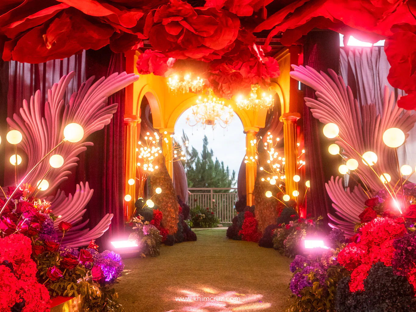 peacock-feather-entrance-tunnel-red-floral-canopy-80th-birthday-khim-cruz-davao